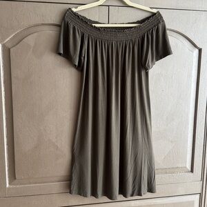 Dress. Green flowing elastic neckline for versatile style.